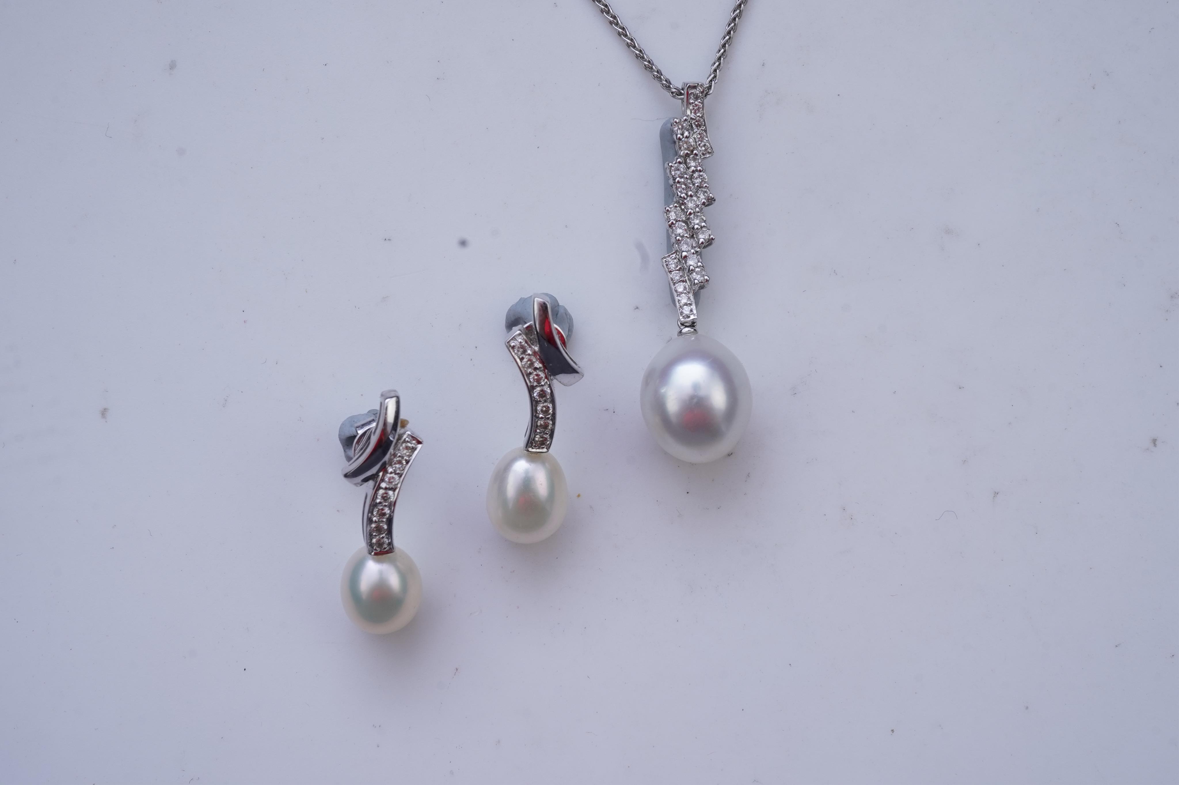 A cultured pearl and diamond demi-parure